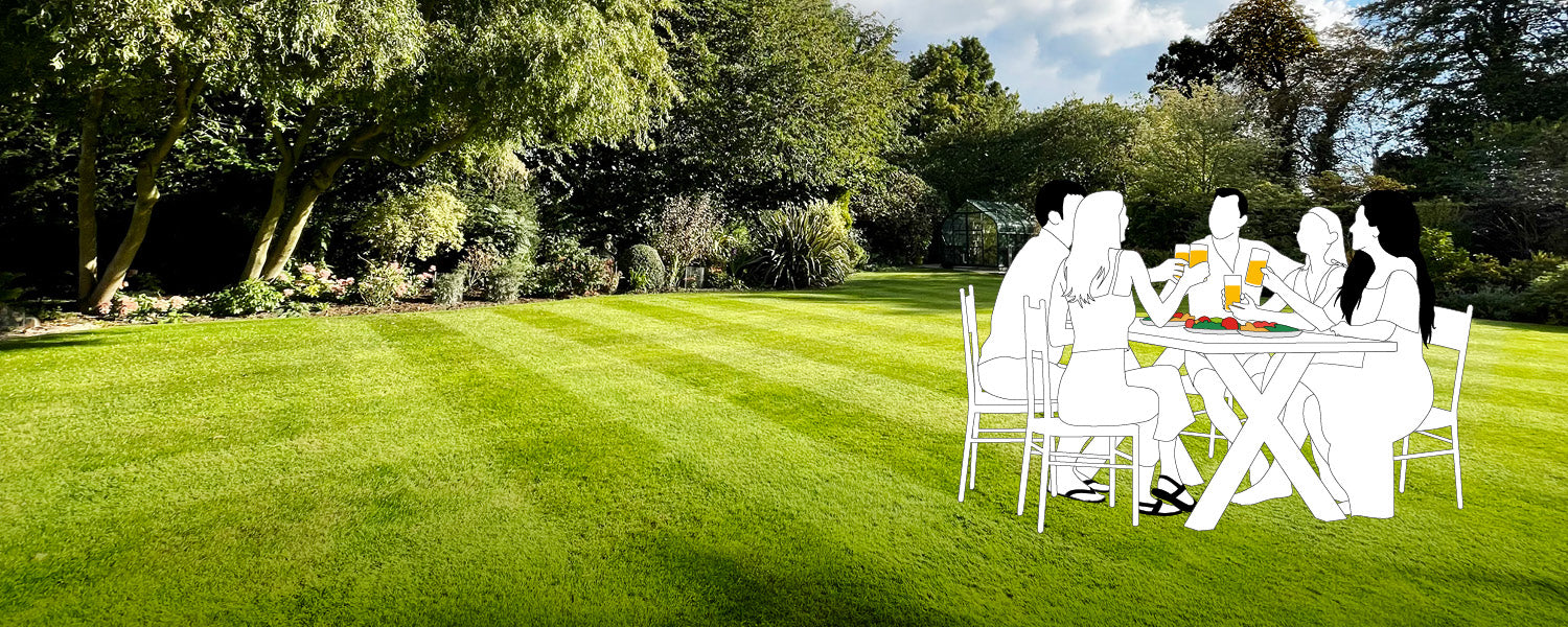 Silhouette of a family sitting at a table in a striped garden