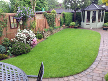 A beautiful small garden with a lawn treated by the team at GreenThumb Leicestershire West