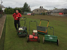 Tyler Stevenson on a lawn with GreenThumb Machinery 