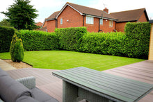 lush lawn with garden table treated by GreenThumb Gwynedd