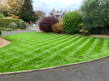 Lush lawn with stripes treated by GreenThumb Lancaster