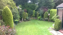 A beautiful garden with a healthy green lawn treated by GreenThumb Bury