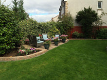 lush lawn with flowers treated by GreenThumb Falkirk