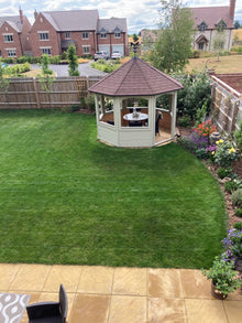 Beautiful garden with grass treated by the team at GreenThumb Redditch