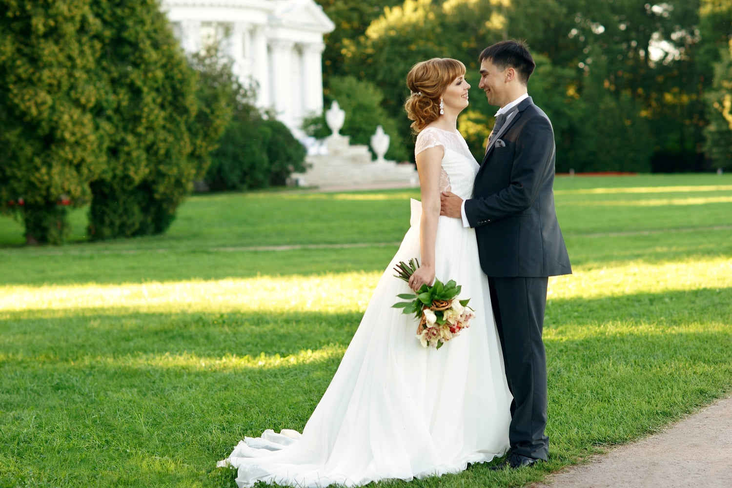 Bride and Groom posing on a lovely GreenThumb lawn